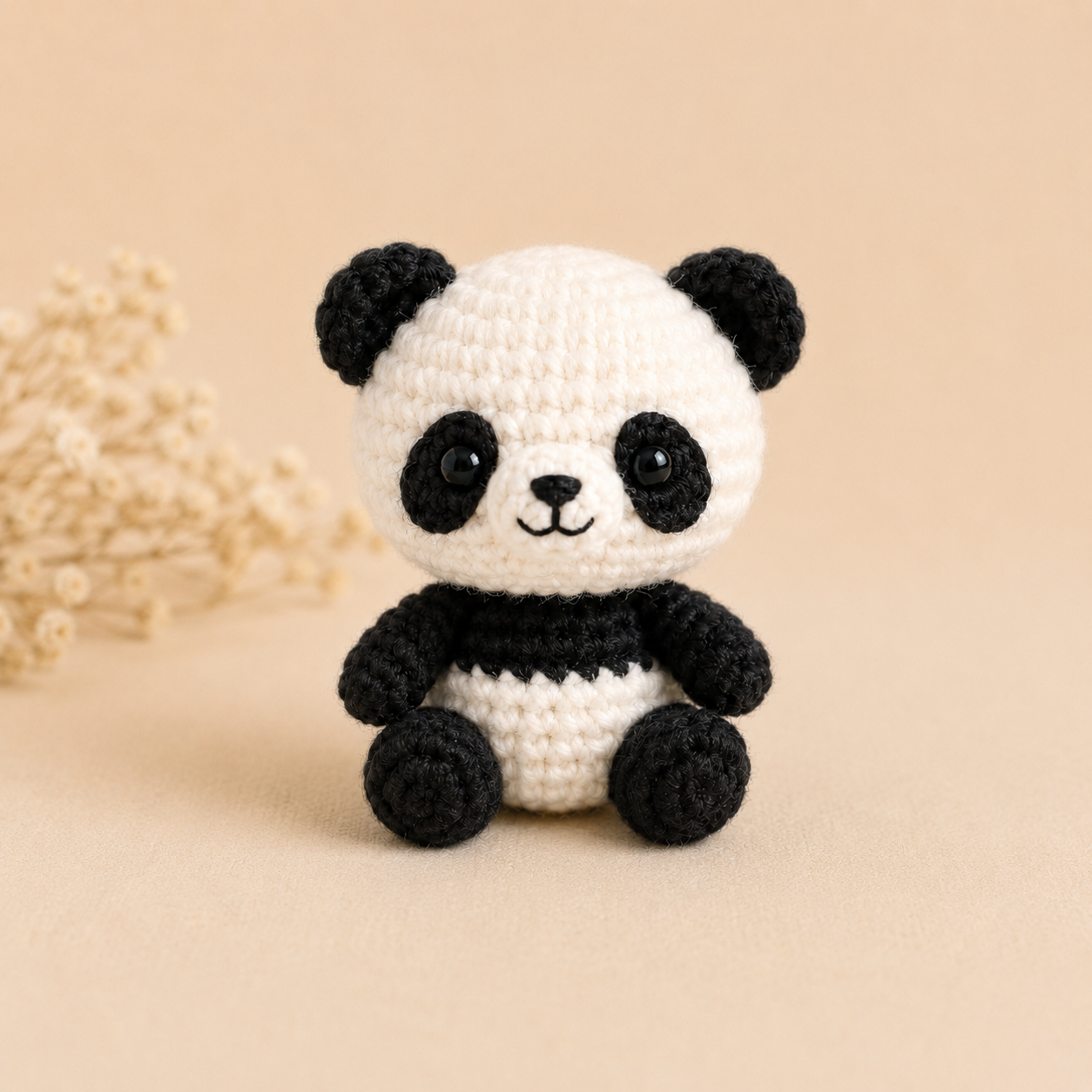 Finished mini panda crochet pattern front view
