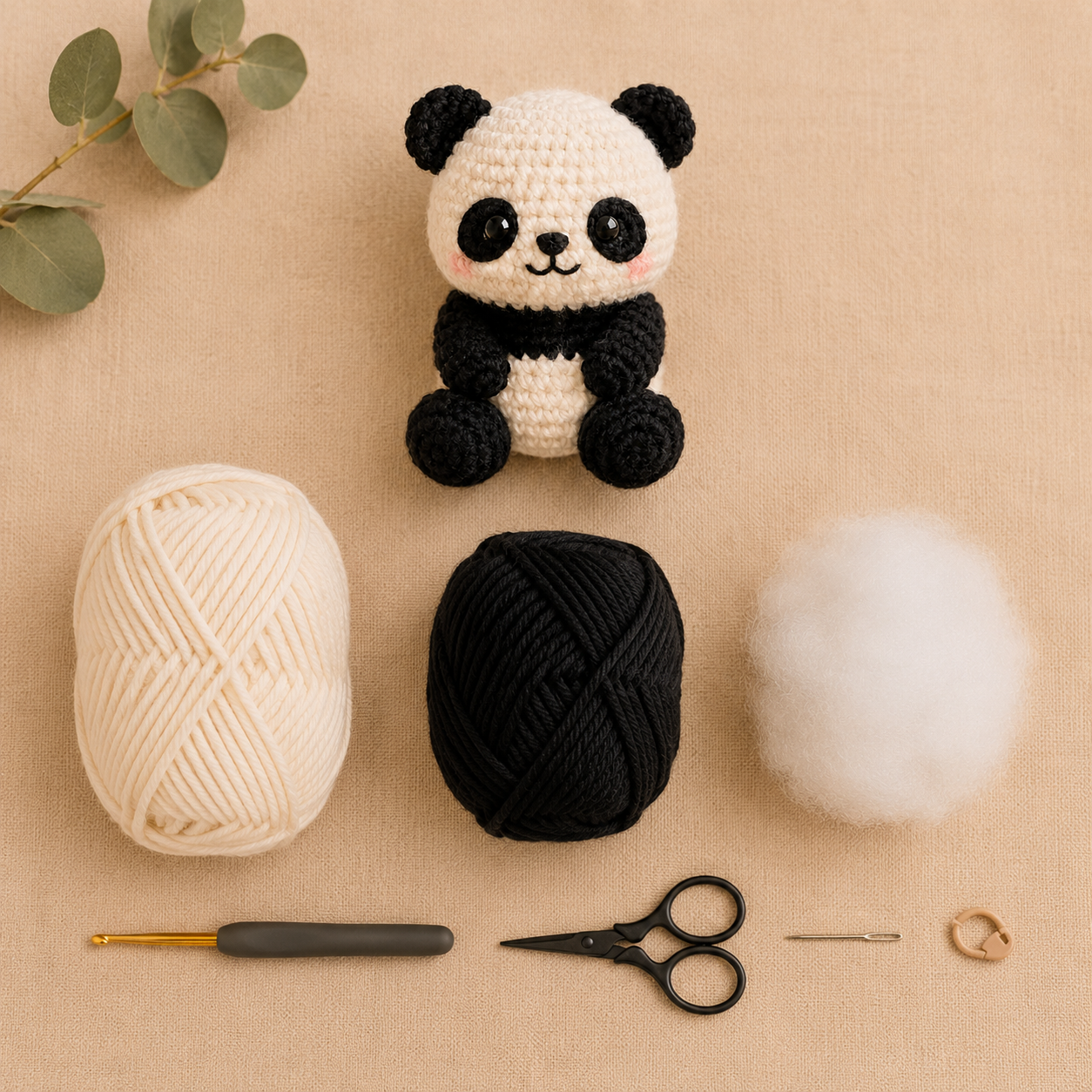 Materials for a no sew panda crochet pattern