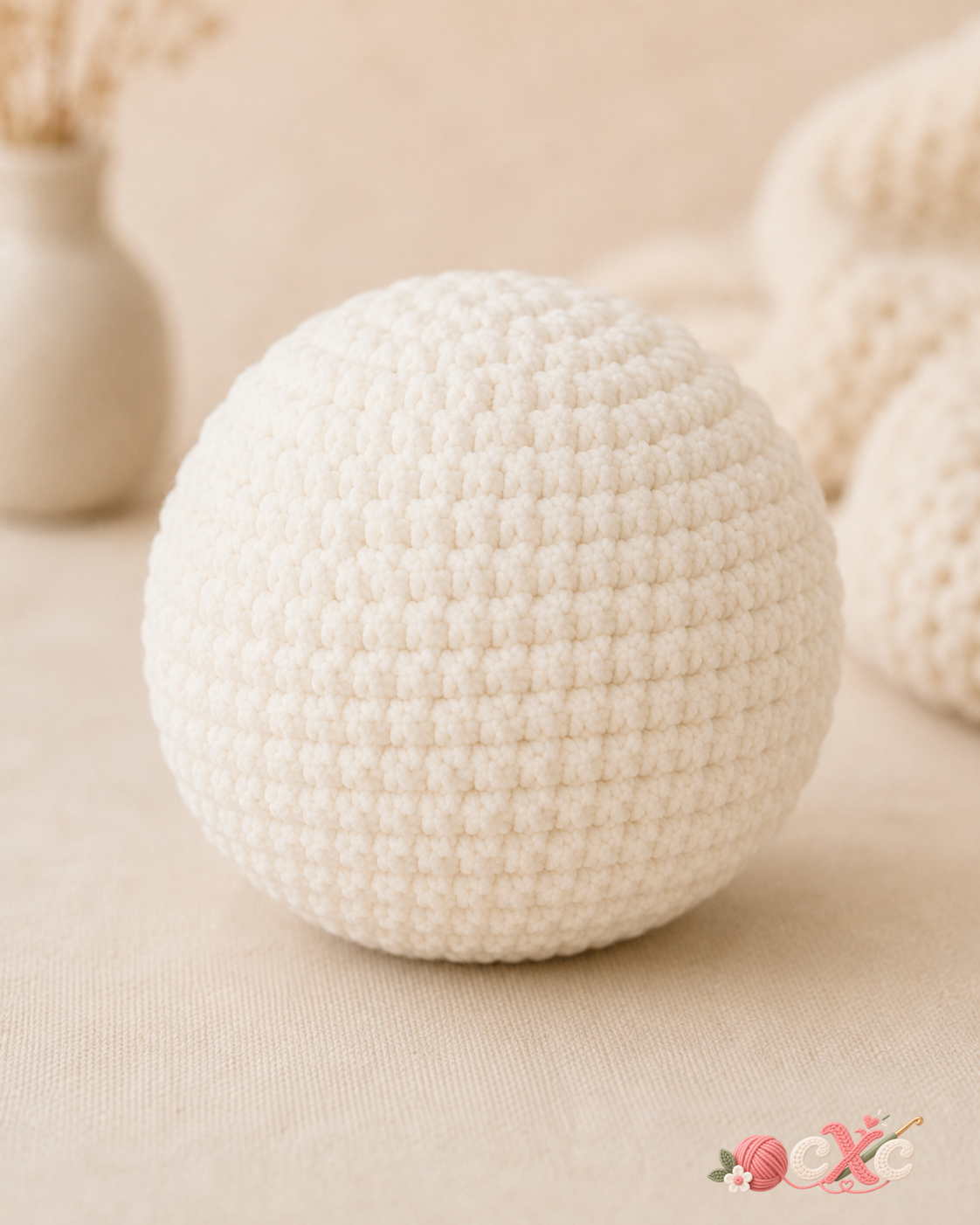 White crochet panda head before adding facial details